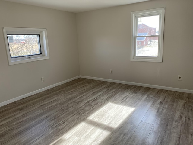 spare room with hardwood / wood-style flooring