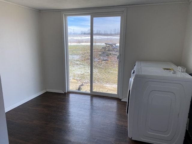 laundry area with dark wood-type flooring, a wealth of natural light, and independent washer and dryer