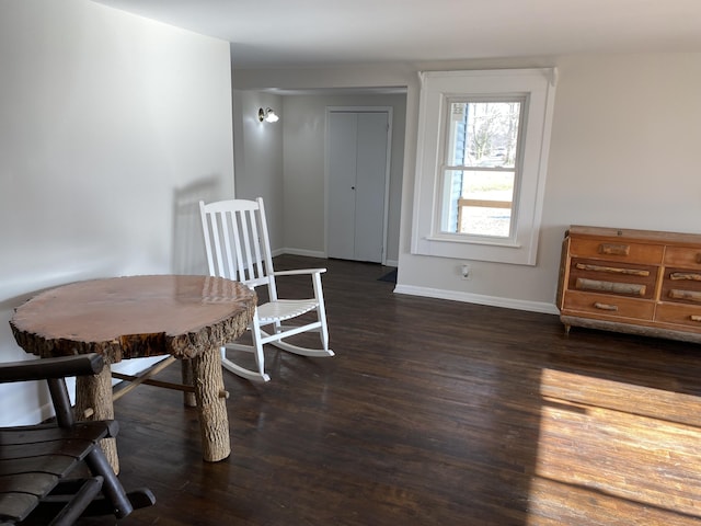 dining space featuring dark hardwood / wood-style flooring