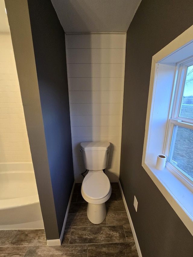 bathroom with a bathtub and toilet