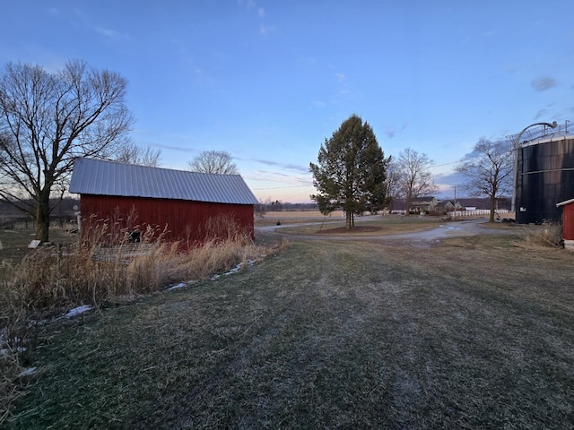 yard at dusk with an outdoor structure