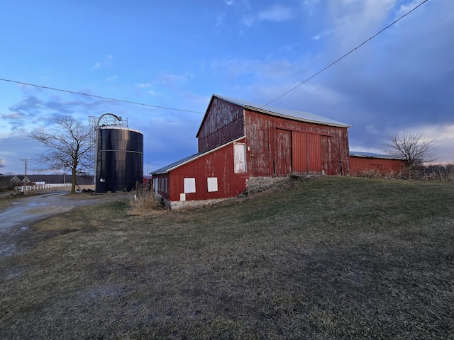 view of outbuilding with a yard