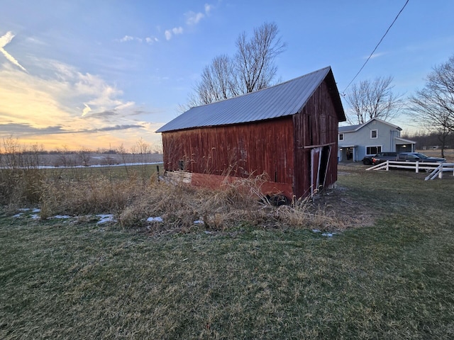 outdoor structure at dusk with a yard