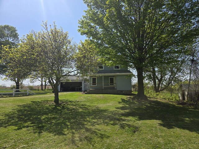119 W Pearl Rd, Coldwater, MI 49036 - view of yard with covered porch and a garage