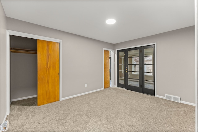 unfurnished bedroom featuring carpet floors and a closet