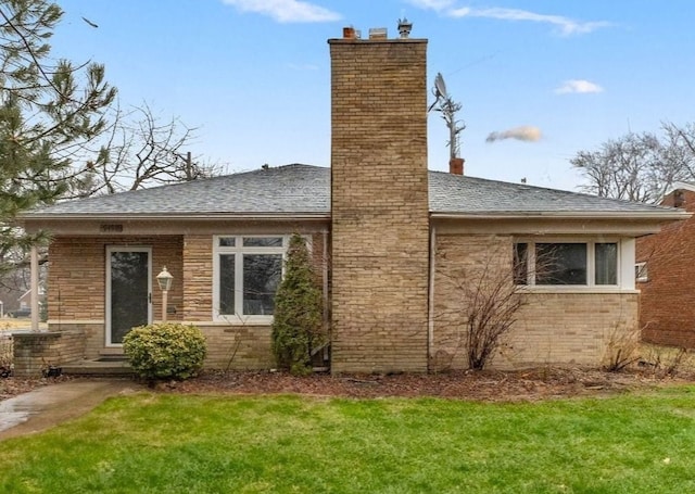 view of side of home featuring a lawn