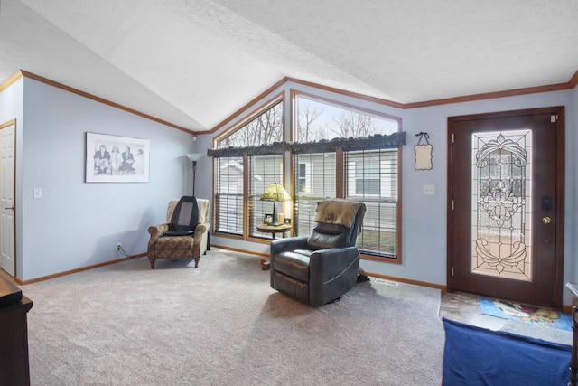 sitting room featuring carpet floors, vaulted ceiling, ornamental molding, and a textured ceiling