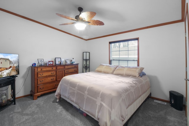 carpeted bedroom featuring ornamental molding and ceiling fan