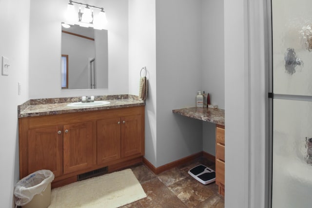 bathroom featuring vanity and an enclosed shower