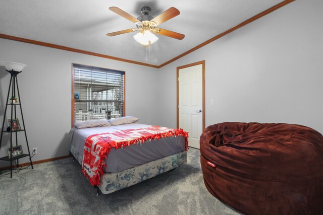 carpeted bedroom featuring crown molding, vaulted ceiling, and ceiling fan