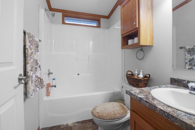 full bathroom featuring vanity, shower / bathing tub combination, crown molding, and toilet