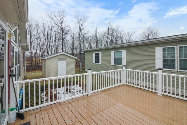 wooden terrace with a storage shed