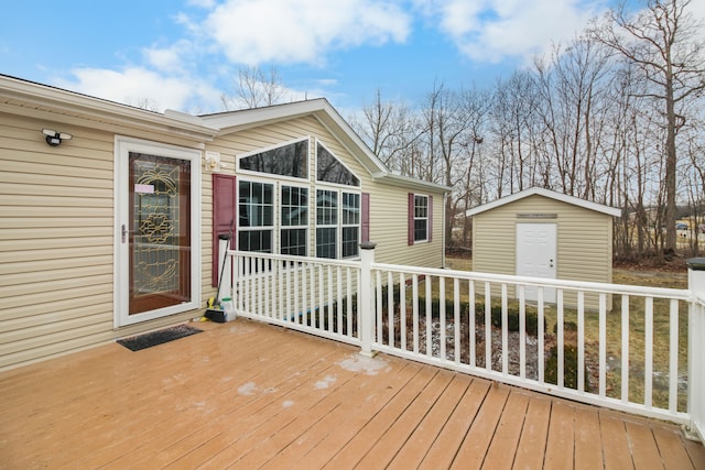 wooden deck featuring a storage unit