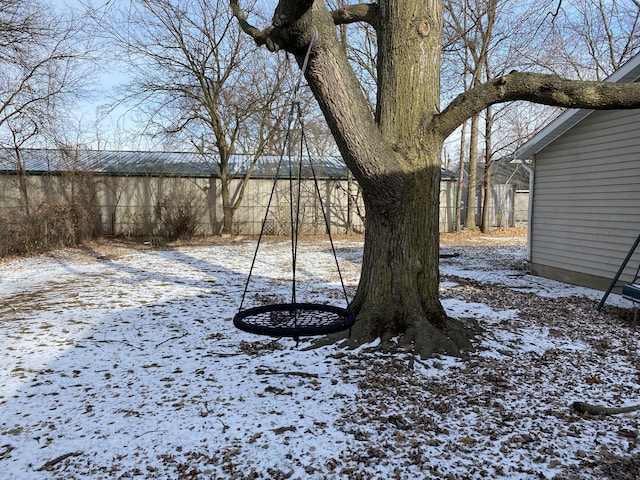 view of yard layered in snow