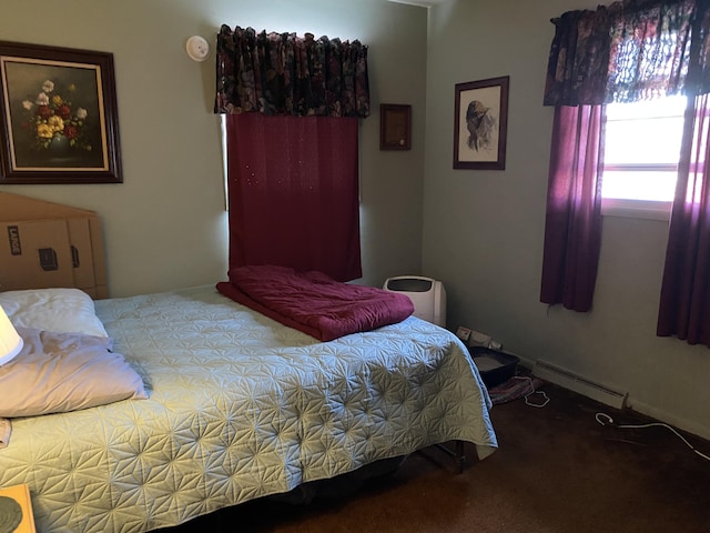 carpeted bedroom with baseboard heating