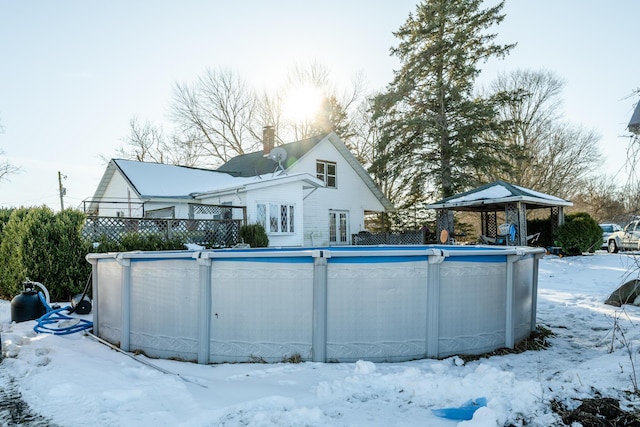 exterior space with a fenced in pool and a gazebo