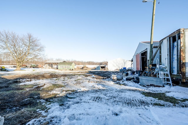 view of yard layered in snow