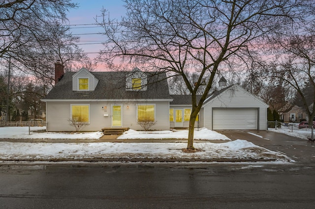 cape cod house featuring a garage