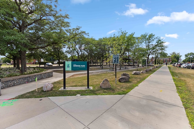 view of home's community featuring a lawn