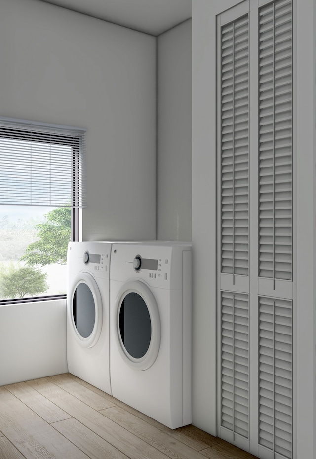 washroom featuring washer and dryer and light wood-type flooring