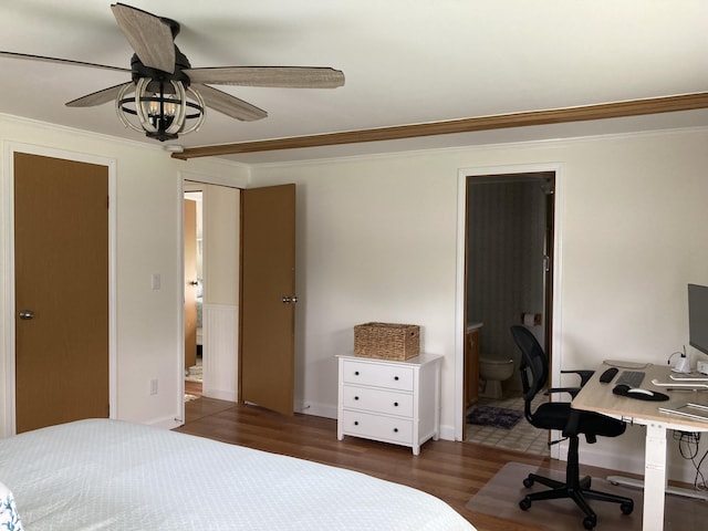 bedroom with ensuite bath, dark wood-type flooring, ornamental molding, and ceiling fan