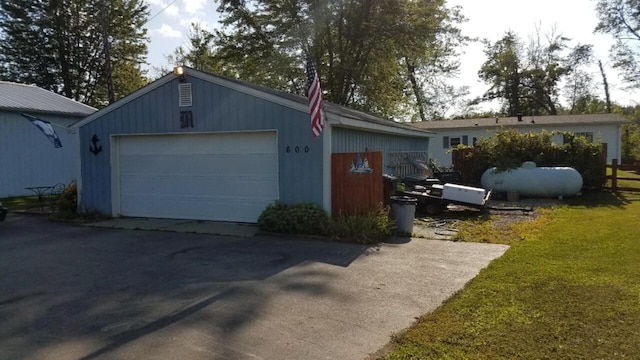 exterior space featuring a garage and an outdoor structure