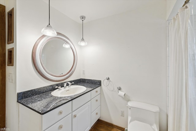 bathroom with vanity and toilet