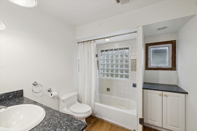 full bathroom with shower / bath combination with curtain, vanity, toilet, and hardwood / wood-style floors