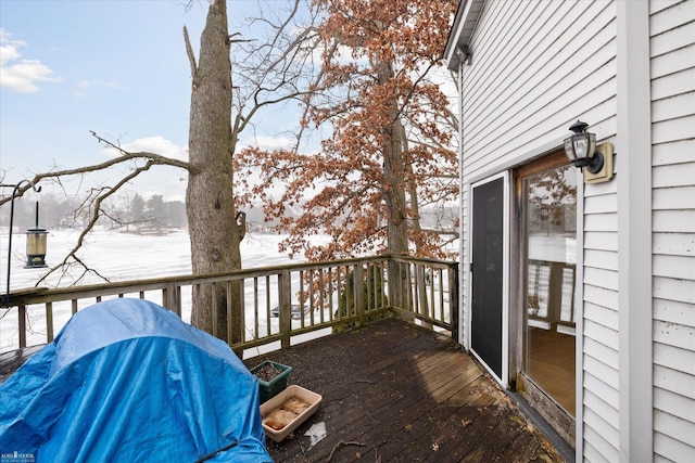 view of snow covered deck