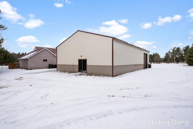 9322 E 56th St, Newaygo, MI 49337 - snow covered property featuring an outbuilding and an outdoor structure