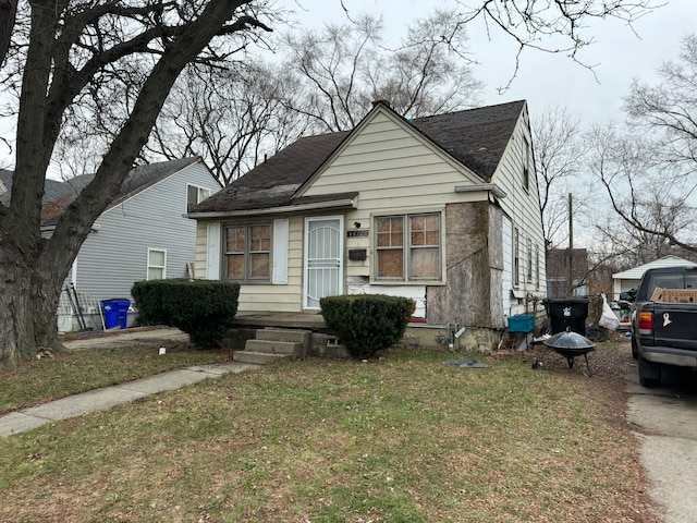 bungalow with a front yard