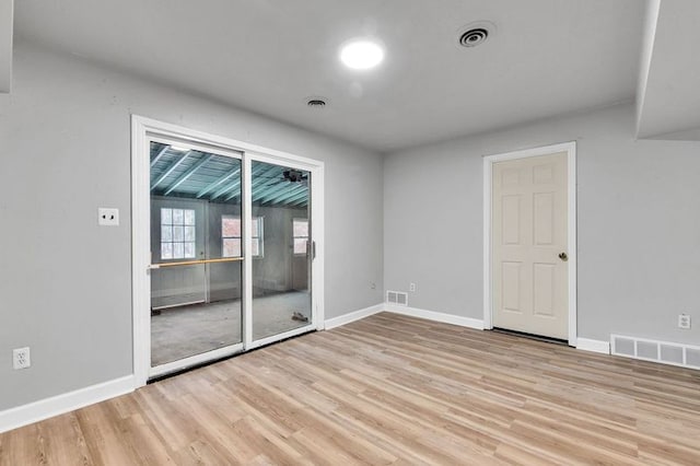 unfurnished room featuring light hardwood / wood-style floors