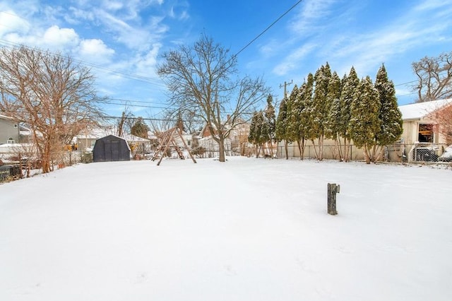 view of yard layered in snow