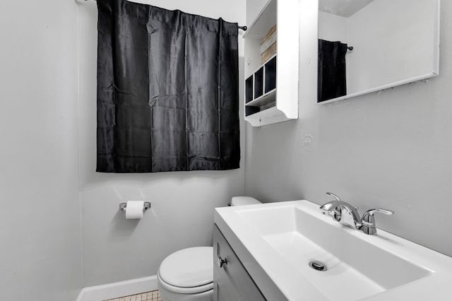 bathroom with vanity and toilet