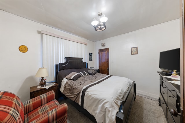 bedroom with carpet and a chandelier