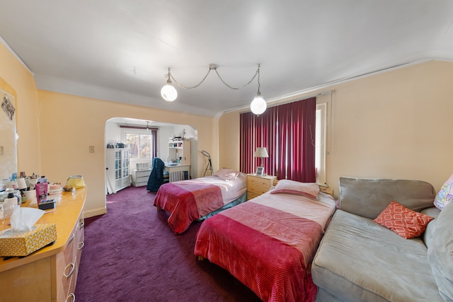 carpeted bedroom with lofted ceiling and ornamental molding