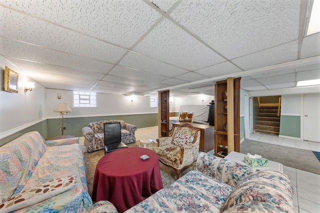 tiled living room with a drop ceiling