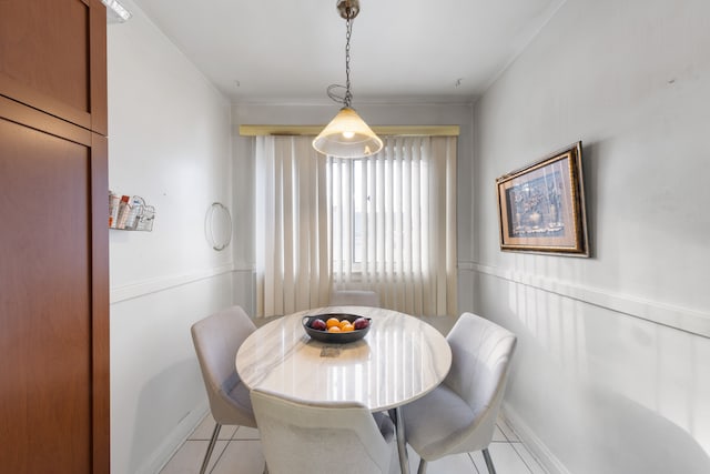 dining space featuring light tile patterned flooring