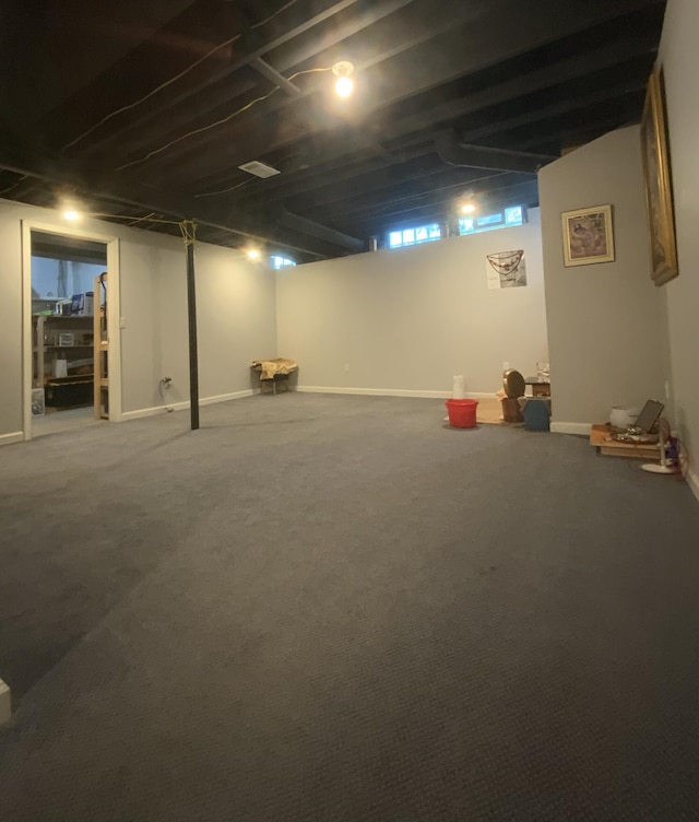 basement featuring carpet flooring