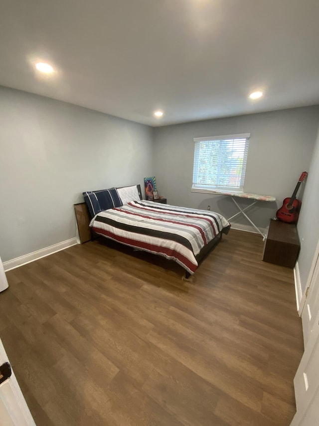 bedroom featuring dark hardwood / wood-style flooring