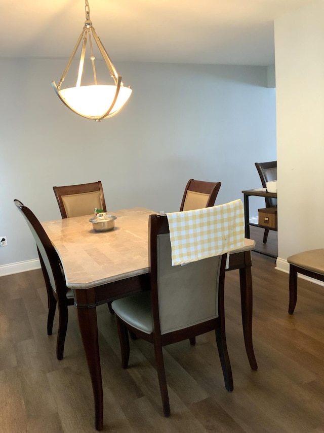 dining area featuring dark hardwood / wood-style flooring