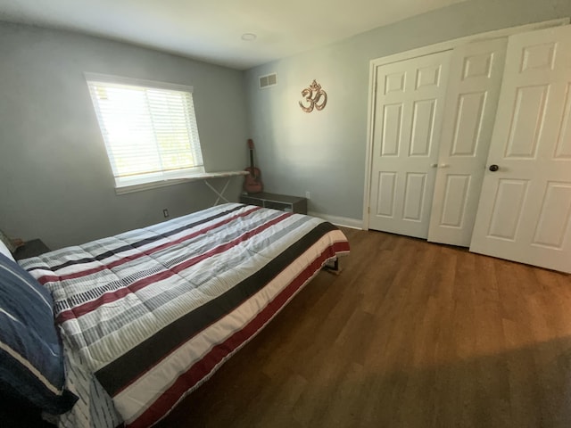 unfurnished bedroom with dark wood-type flooring