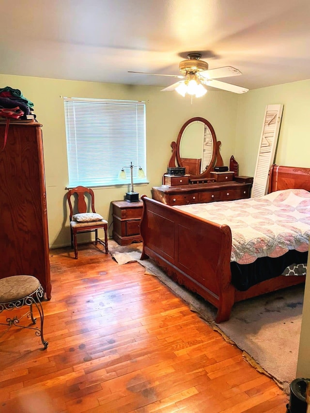 bedroom with ceiling fan and light wood-type flooring