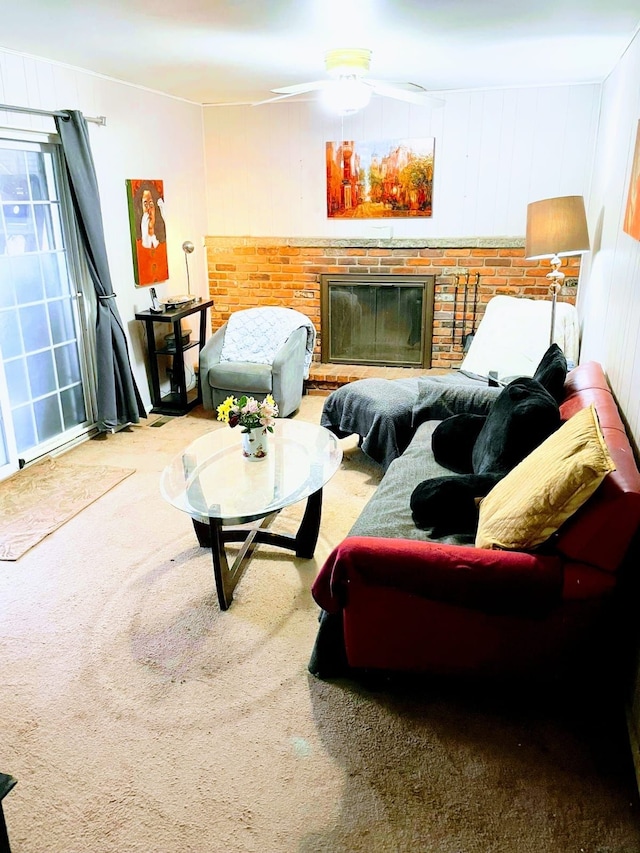 sitting room featuring a fireplace and carpet floors