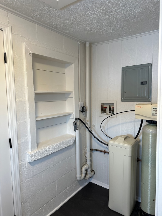 clothes washing area featuring hookup for a washing machine and a textured ceiling