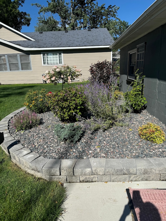 view of home's exterior with a lawn