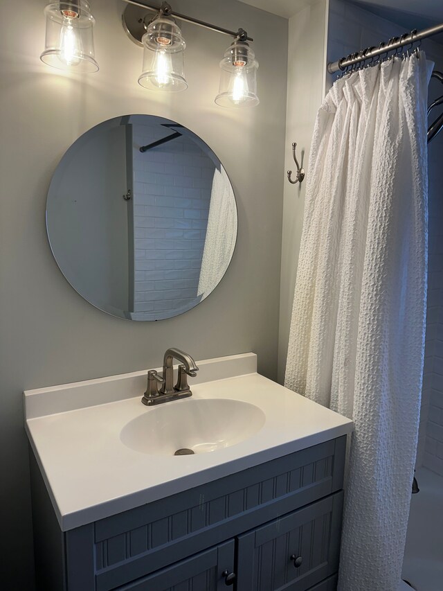 bathroom featuring vanity and walk in shower