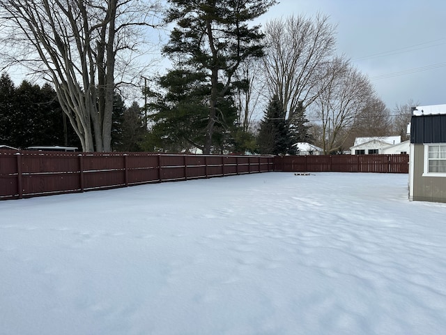 view of yard covered in snow