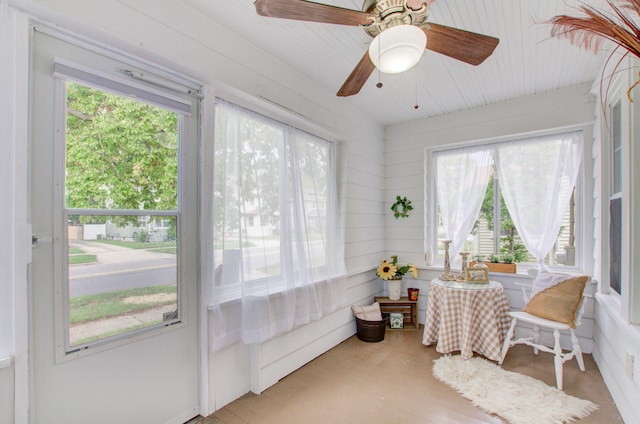 sunroom / solarium featuring ceiling fan and a wealth of natural light