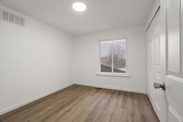 unfurnished room featuring light wood-type flooring